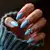 Sky Blue Crystal Accents: Boho Nail Design for Tan Skin