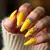 Golden Hour Glow: Yellow Stiletto Nails for a Tan Skin Tone