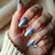 Blue Chrome Stiletto Christmas Nails: Marble Magic!