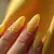 Mesmerizing Yellow Cat Eye Nails: A Party Look